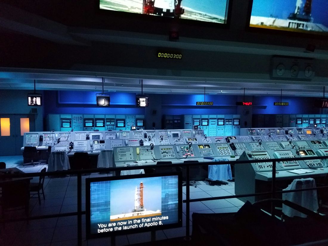 Control room with rows of monitoring screens